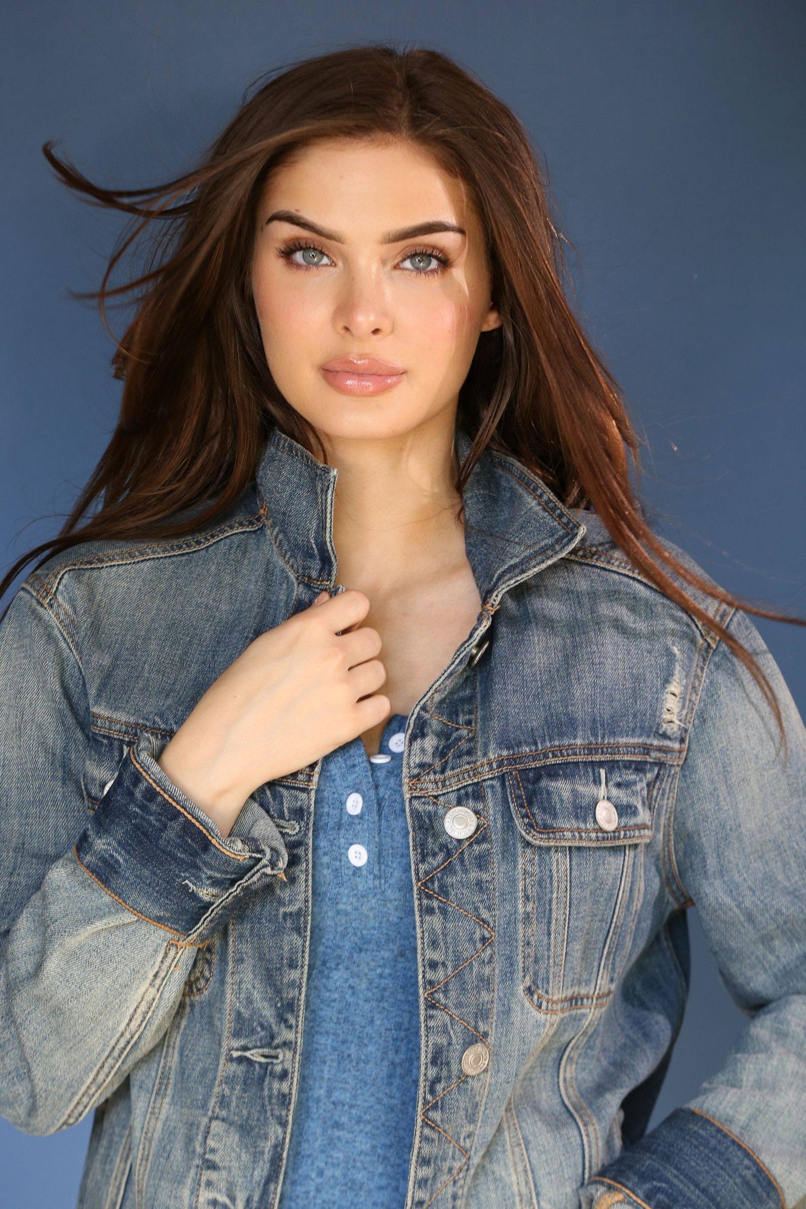 Brighton Sharbino in a denim jacket